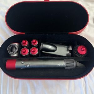 Red Dyson Airwrap™ multi-styler 
attachments for faster and easier styling⁴